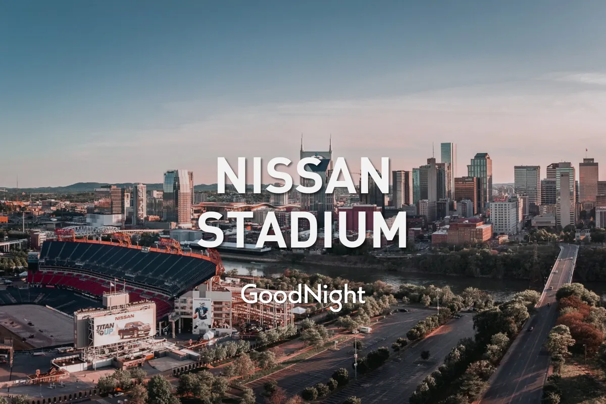 The photo captures Nissan Stadium and the Nashville city skyline along the river, suggesting major family-friendly attractions and scenic walks downtown. The setting feels calm yet lively, with hints of excitement from possible events, concerts, or game days nearby.